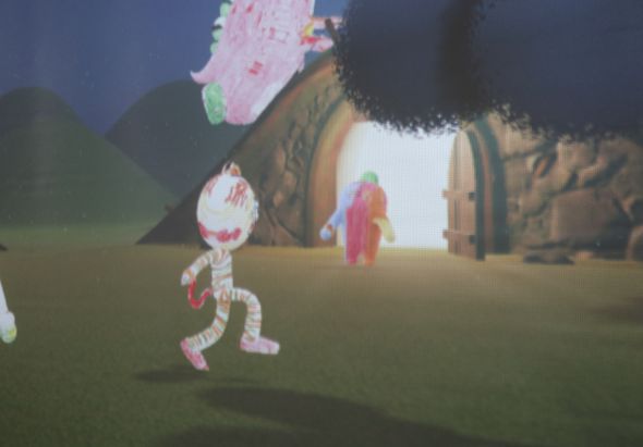 像素風格的3D遊戲場景，地面上有一個紅白相間的卡通角色在跳躍，背景是棕色的岩石山壁和洞穴。上方漂浮著粉紅色和白色的物體，右側站著一個紅色人物。整體呈現復古電子遊戲的視覺風格。